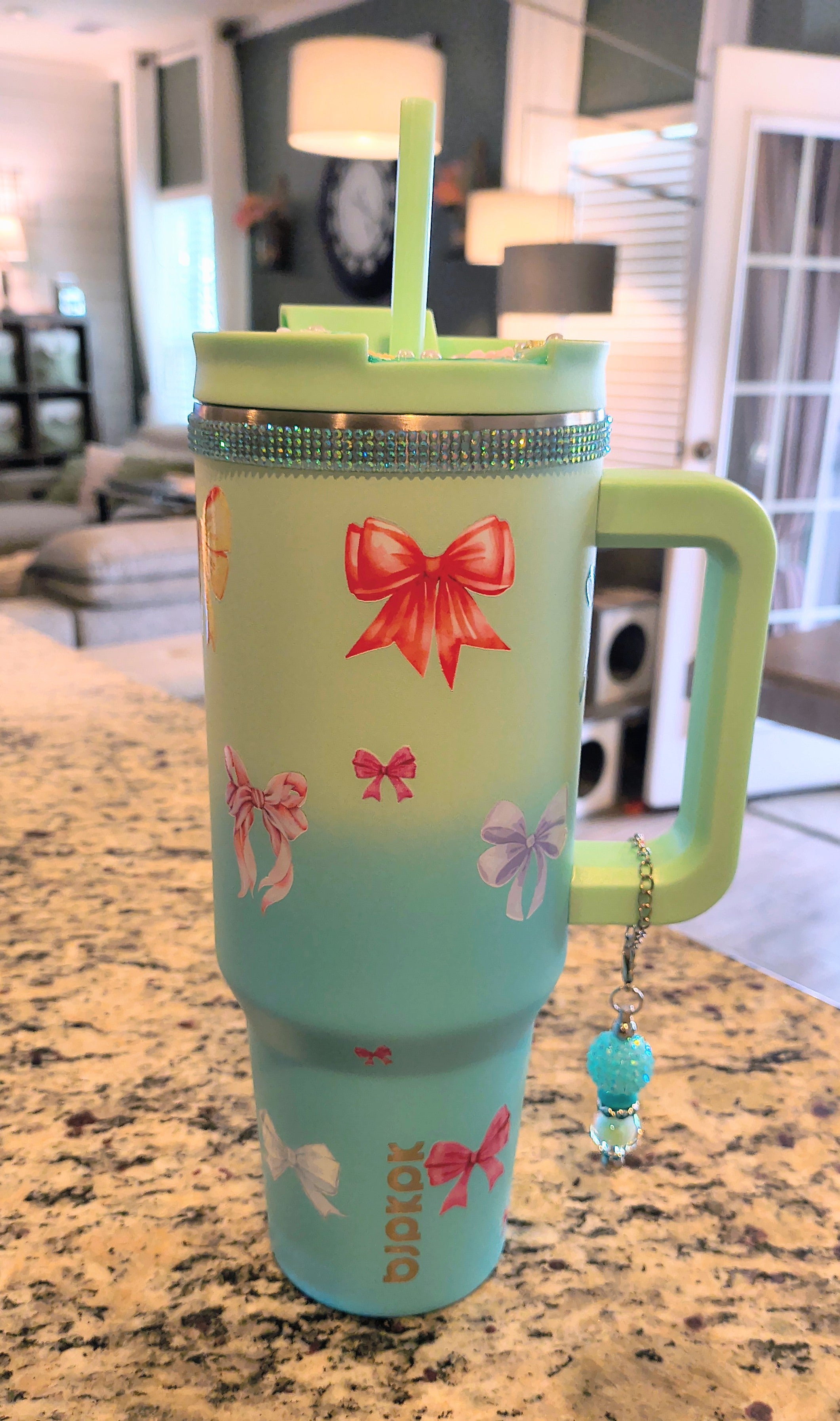 BOW 40 oz stainless steel tumbler with charm and decorated lid